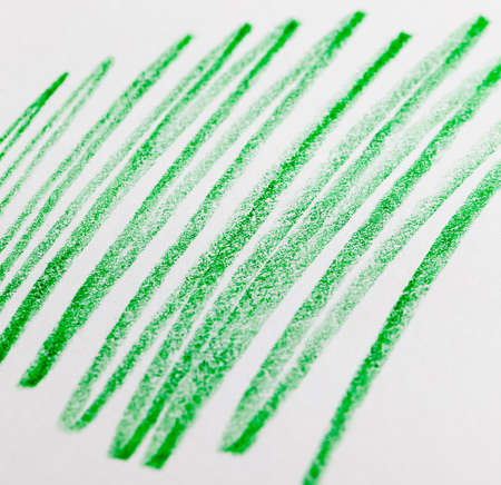 chaotic lines in green pencil on ordinary paper of poor quality, close-up of homemade Amateur drawingの写真素材