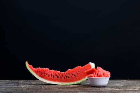 slices and chunks of red juicy watermelon sliced on the table, natural food product, closeupの写真素材