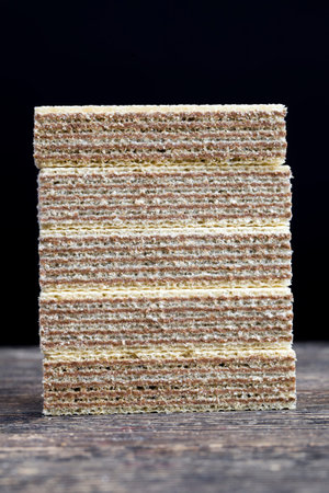 only waffles made from flour and chocolate, close up food made in an industrial plant, high in calories and sugarの写真素材