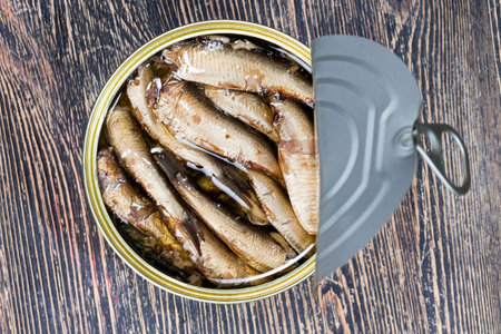 open metal tin with smoked fish inside, close-up