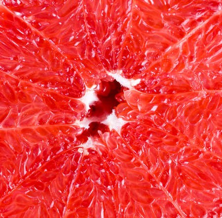 whole peeled and sliced citrus peels, half-juicy, beautiful grapefruit, fruit textures with juice bagsの写真素材