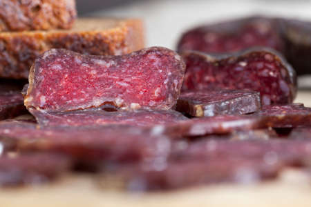 sliced at home slices of meat sausage with lard, sliced for making sandwiches and serving the table with meatの写真素材