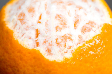 peeled mandarin and sliced, close-up of citrus fruits, Juicy tangerine orange colorの写真素材