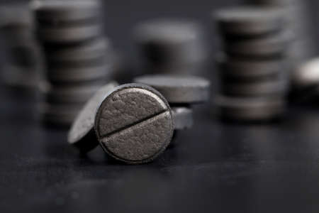 black tablets of activated carbon, used in Eastern Europe in the treatment of indigestionの写真素材