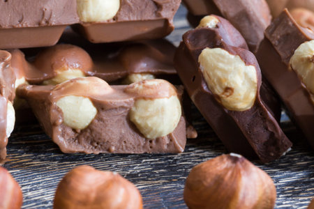 made from real cocoa quality milk chocolate with roasted hazelnut core, close-up of cocoa sweets