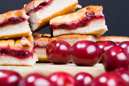 Cherry pie traditionally baked from wheat flour and red cherry berries, a layer of cherry jam, high quality bakingの写真素材