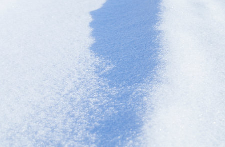 the sunlight illuminated the snow drifts in a Sunny cold winter day
