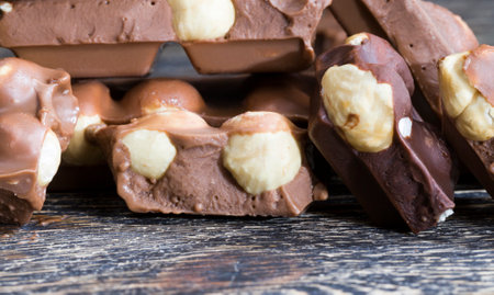 sweet milk chocolate with roasted hazelnuts, close-up of sweets and dessertsの写真素材