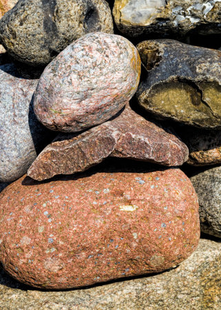 part of the ancient stone wall of the fortress, made of stones and cobblestones of different sizes