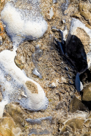 structure of large real stone having uneven rough structure, close-up of building materials for...