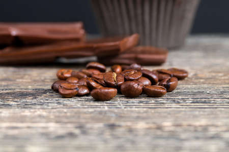 beautiful coffee beans ready for the preparation of invigorating drinks, contains caffeine, coffee in a white mugの写真素材