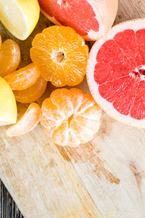 cut into pieces ripe orange red grapefruit, close - up of citrusの写真素材