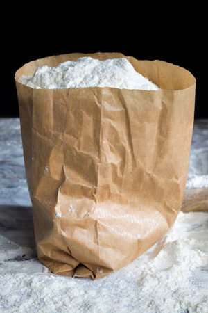 white wheat flour in a simple paper bag, is the ingredients for cooking food from durum wheatの写真素材