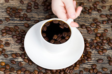 beautiful coffee beans coffee floating in brown cooked coffee drink, drinks closeup
