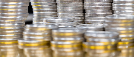 stack of old gold-lit coins, close-up of metal money with flaws and defectsの写真素材