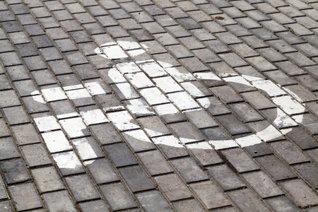 old road made of paving stones for traffic and pedestrians, close-up of a part of the public road, a...