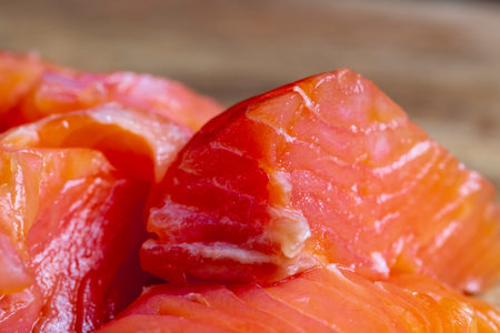 red salted fish cut into chunks during cooking, cooking sandwiches using red salmon fish