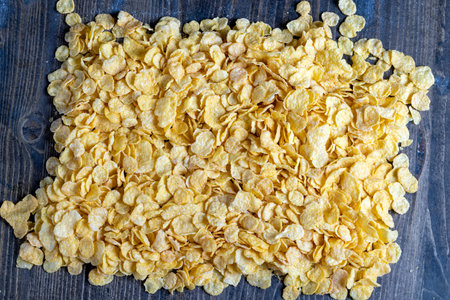 dry breakfast corn flakes of yellow color, preparation of corn dry breakfast of flour in the form of...