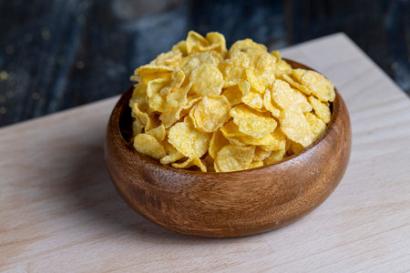 dry breakfast corn flakes of yellow color, preparation of corn dry breakfast of flour in the form of...