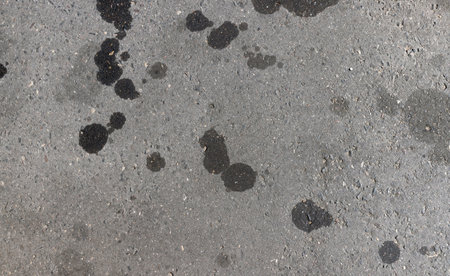 a highway with oil stains on the surface, a polluted highwayの写真素材