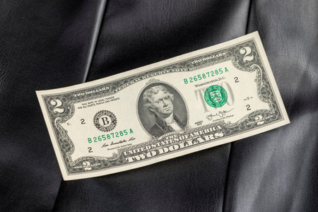 two United States dollar paper banknote parts, closeup obverse of the banknote with a portrait,...