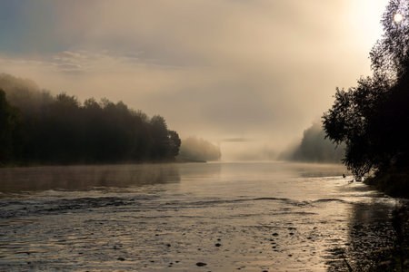 Foggy morning on the river, sunrise dispels a little fog in the lowlandsの写真素材