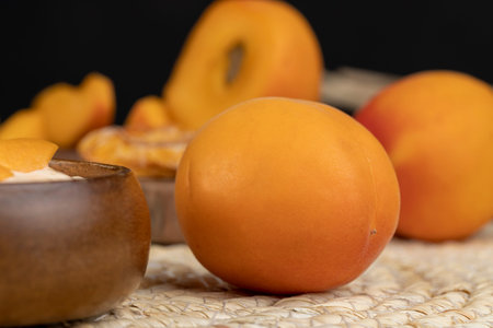 fresh juicy peach on the table, fresh exotic fruits in the kitchenの写真素材