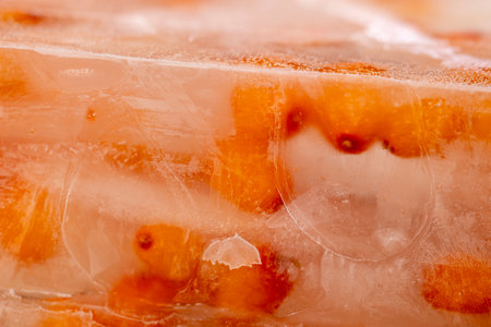 frozen orange sea buckthorn berries, ripe sea buckthorn berries during deep freezing, close upの写真素材