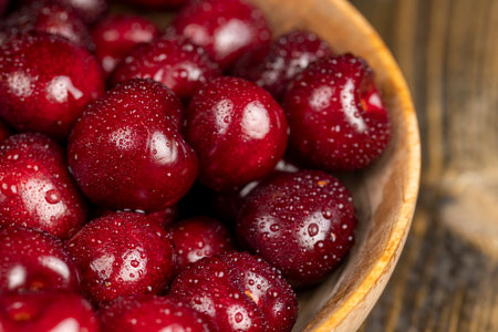 wet cherry fruits on the kitchen table, view from aboveの写真素材