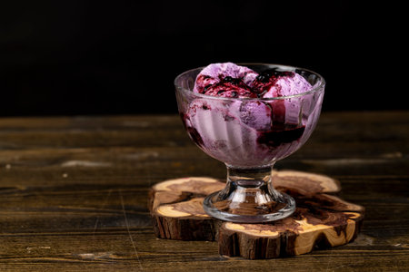 ice cream with blueberry , blueberry ice cream balls with blueberry jam, side viewの写真素材