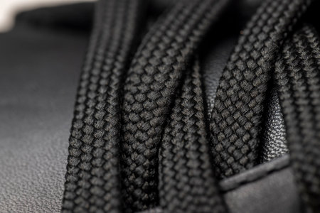 black braided laces on leather shoes, details of the laces for black shoes close up, side viewの写真素材