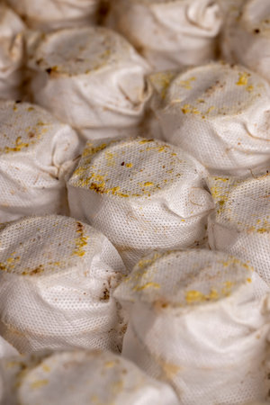 mattress springs after use, glued together old mattress springs in white fabric after long-term use, close upの写真素材