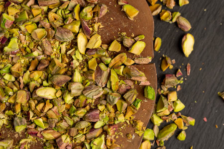 fried pistachios for cooking, chopped into pieces crispy pistachios fried with salt, side viewの写真素材
