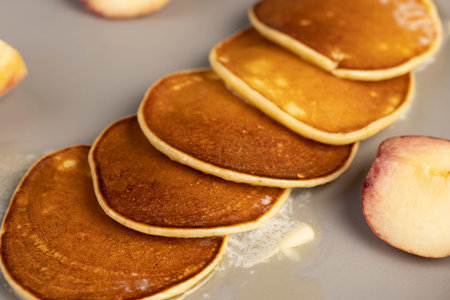 melting butter on pancakes from milk with flour, close up