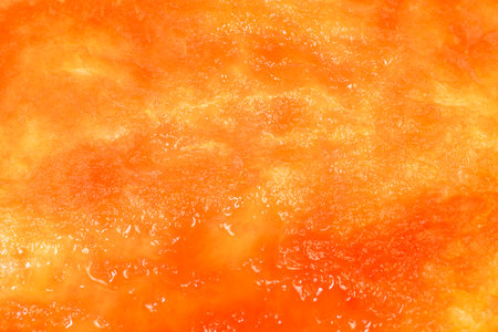 a red ripe watermelon, the sweet flesh of which has been eaten to a green peel, part of the watermelon inside which the green part of the peel is visible through the ripe pulpの写真素材