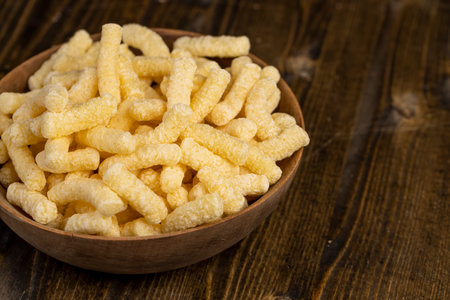 corn sticks closeup, a large number of corn sticks for eating or making breakfast with milk, corn sticks in a wooden bowlの写真素材