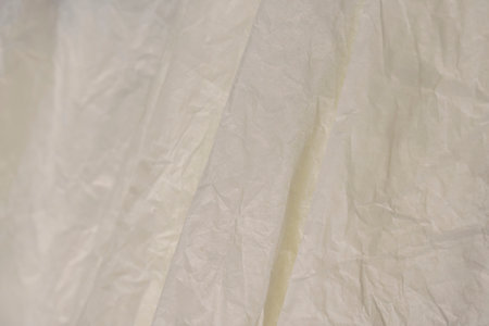 wrapping paper after prolonged use, thin paper made of cellulose as a packaging material for clothingの写真素材