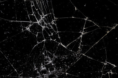 broken with a lot of damage of glass on a black background, thin glass broken into many pieces