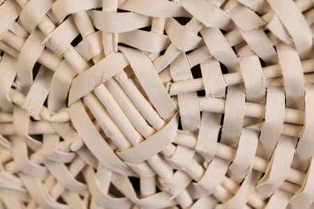 a white wicker basket for food or other items, natural branches painted white from which a...