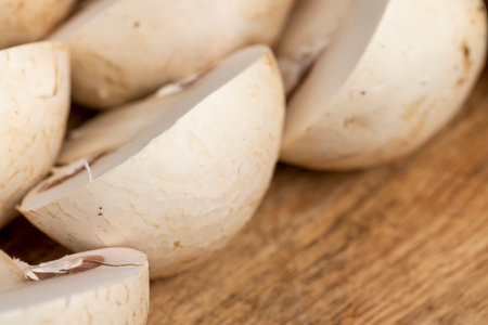 cut champignons unpeeled from the ground, preparation of the harvested mushroom champignons for cooking, close upの写真素材