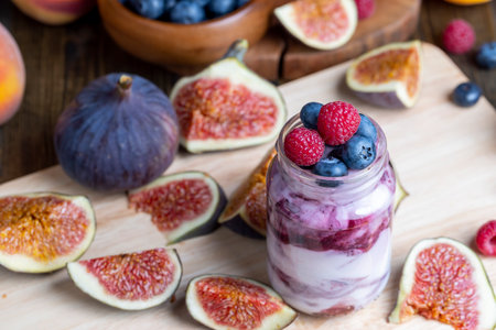 Fresh delicious yogurt made from milk with blueberry flavor, yogurt with fresh berries and blueberry jamの写真素材