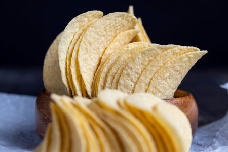 Crispy potato chips fried with spices, a bunch of potato chips ready for meals