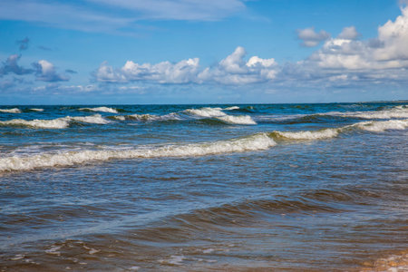 Waves in windy weather on the Baltic Sea in August, seascape in summer on the Baltic Sea
