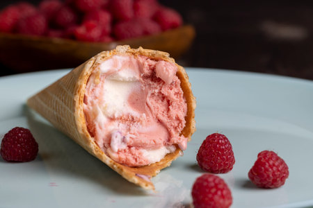 Ice cream with creamy raspberry flavor, delicious ice cream on the table with raspberries