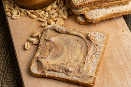 Peanut paste with chocolate paste on white bread, making sandwiches from mixed chocolate peanut paste and breadの写真素材