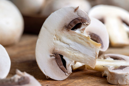 Cooking a dish of mushrooms cut into pieces on a blackboard, ripe mushrooms for cookingの写真素材