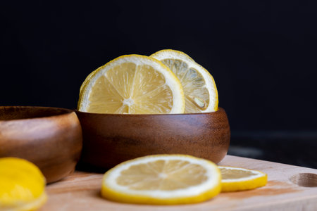 Fresh yellow lemon with lots of juice, cut into pieces ripe juicy lemonの写真素材