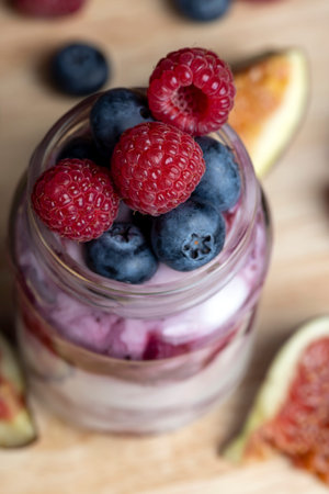 Fresh delicious yogurt made from milk with blueberry flavor, yogurt with fresh berries and blueberry...