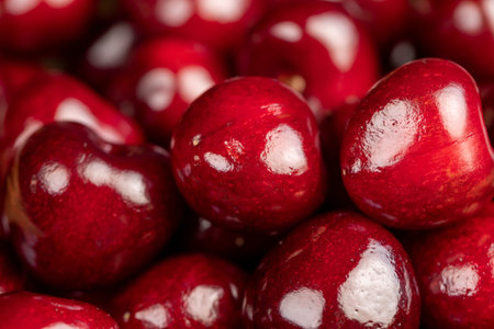 delicious ripe red cherry berries, red cherry fruits on the kitchen table close up