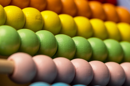 wooden beads on abacus for play, wooden children's abacus for learning and development, closeup